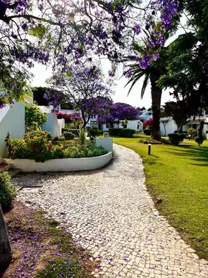 a table and chairs sitting on a patio at Superior Apartment 361 Balaia Golf Village in Olhos de Água