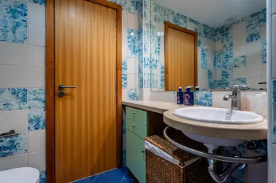 a bathroom with a sink and a mirror at Marina 4B 1D By RS in Albufeira