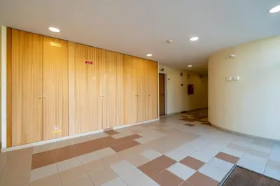 an empty hallway with wooden lockers in a building at Marina 4B 1D By RS in Albufeira