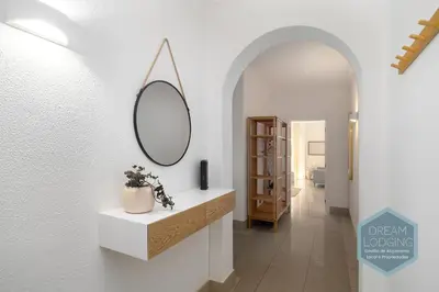 a bathroom with a mirror on a wall at Casablanca - Dream Lodging in Albufeira