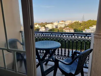 a table and chairs on a balcony with a view at Mar à Vista Apartment in Albufeira