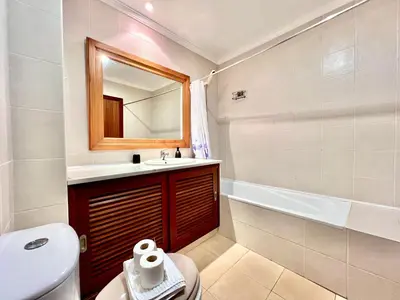 a bathroom with a sink and a toilet and a tub at Albufeira Salgados Beach 6 by Homing in Albufeira