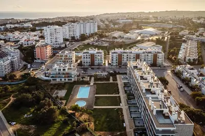 an aerial view of a city with buildings at Albufeira Green Dream Pool, Balcony & BBQ in Albufeira