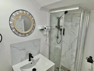 a white sink in a bathroom with yellow wallpaper at Al Mare Ocean View in Albufeira