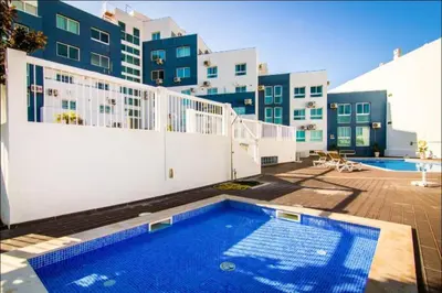 a swimming pool in front of a building at Paradise Near Old Town in Albufeira