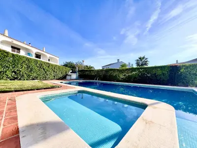 a swimming pool in the backyard of a house at Vilamoura Classic 2 with Pool by Homing in Quarteira