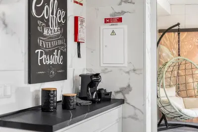a kitchen with a counter with a coffee maker on it at Casa dos Avós - Faro Relax & Comfort in Faro