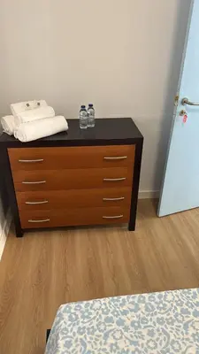 a dresser with glasses on top of it in a room at Sweet Dreams in Albufeira
