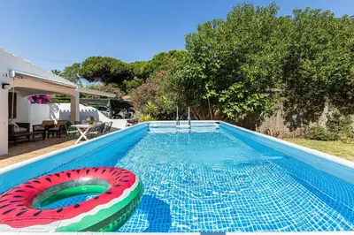 a swimming pool with a toy inflatable at Casa Charlotte na Quinta da Balaia in Albufeira