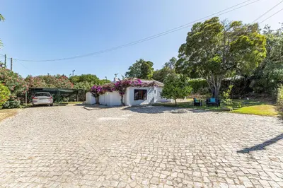 a hallway with a table and a dining room at Casa Charlotte na Quinta da Balaia in Albufeira
