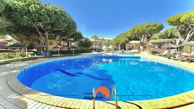 a swimming pool at a resort with dolphins in the water at #269 T2 Bicos Flat R by Home Holidays in Albufeira