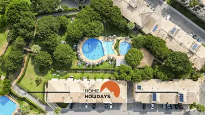 an aerial view of a home holidays resort with two swimming pools at #269 T2 Bicos Flat R by Home Holidays in Albufeira