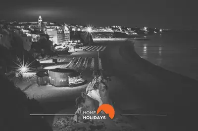 a black and white photo of a city at night at #270 T2 Bicos Flat S by Home Holidays in Albufeira