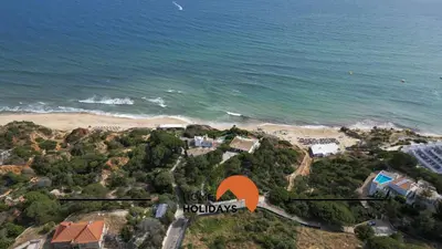 an aerial view of a beach with an orange arrow at #272 T2 Bicos Flat J by Home Holidays in Albufeira