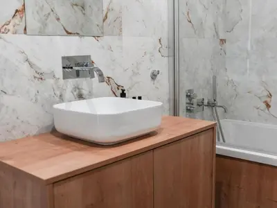 a white sink on a wooden counter in a bathroom at Eco Residence 05 House by Stay ici Algarve Holiday Rental in Albufeira