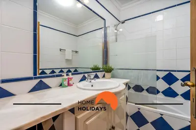 a bathroom with a sink and a shower at #274 T3 Bicos T by Home Holidays in Albufeira