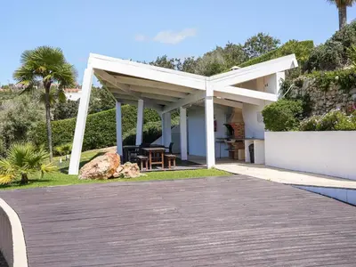 a white pergola on top of a house at Serenity 09 House by Stay ici Algarve Holiday Rental in Albufeira