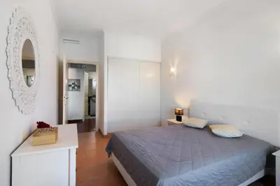 a bedroom with a bunk bed in a room at Oura Beach Cozy Apartment in Albufeira
