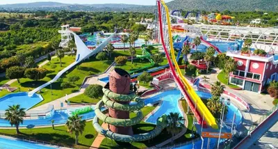 an amusement park with a roller coaster at Quarteira-Your Seaside Getaway in Quarteira