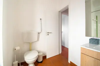 a bathroom with a toilet and a sink at BeGuest Vila Magna Apartment in Albufeira