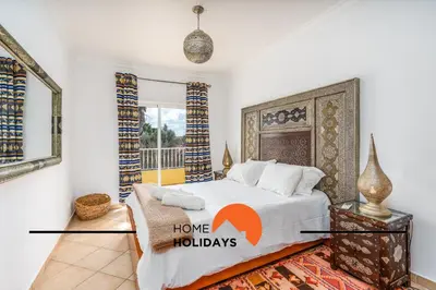a bedroom with a bed and a window at #298 Villas Luz H by Home Holidays in Albufeira