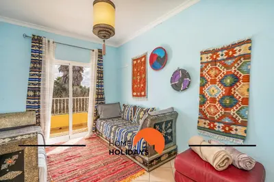a living room with a couch and a window at #298 Villas Luz H by Home Holidays in Albufeira