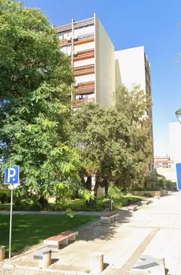 a parking sign in front of a building at Casa Ligia in Vilamoura