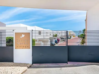 a white building with a sign that reads justice house wines at Villa Maria, 3BD & Pool & Garden & BBQ in Albufeira
