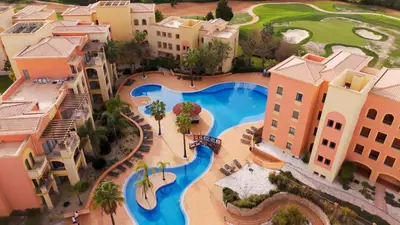 an overhead view of a swimming pool in a resort at Apartamento Vitoria in Vilamoura