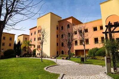a row of buildings with a walkway in front at Apartamento Vitoria in Vilamoura