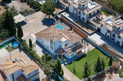 an overhead view of a house with a swimming pool at Casa Coelho in Albufeira