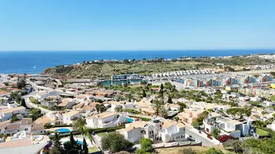 a view of a city with trees and buildings at Stunning Sunrise & Sunset Rooftop Condo by BeCherish in Albufeira