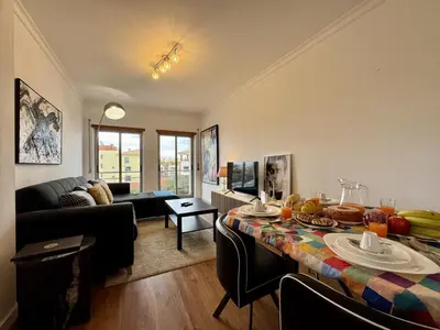 a living room with a table with fruit on it at Albufeira Modern 6 With Pool by Homing in Albufeira