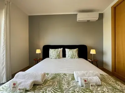 a room with a mirror on a wall at Albufeira Modern 7 With Pool by Homing in Albufeira