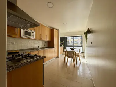 a living room with a table with food on it at Albufeira Modern 7 With Pool by Homing in Albufeira
