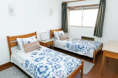 a bedroom with two beds and a window at BeGuest Sea Breeze Apartment in Albufeira