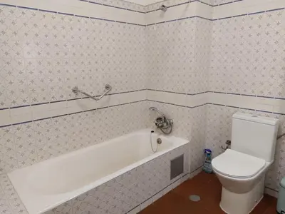 a bathroom with a white tub and a toilet at BeGuest Sea Breeze Apartment in Albufeira