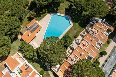 a bedroom with a bed with towels on it at BmyGuest - Vilamoura Golf Villa in Vilamoura