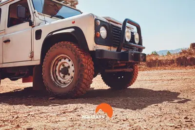 a white truck parked on a dirt road at #305 Albufeira Sea House by Home Holidays in Albufeira