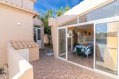 a dining room with a table in a house at Villa Terramar - Golden & Salty in Guia