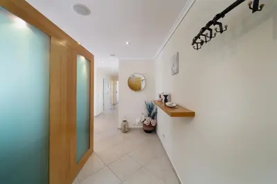 a hallway of a hospital with a hallway at Newly Remodeled 2BD Brilliant Oura Strip 9min beach in Albufeira
