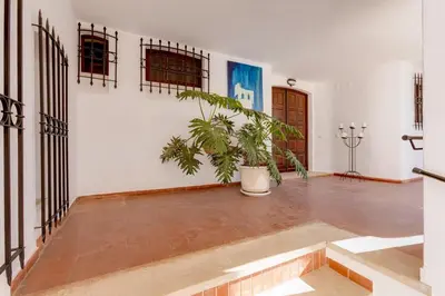 a large empty room with a potted plant in it at Villa SOLAR DO MONTE 3 in Albufeira