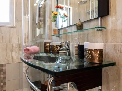 a bathroom with a sink and a glass counter at NEW! Villa Balaia K-11 in Branqueira