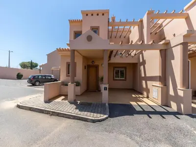 a large building with a staircase on the side of it at NEW! Villa Balaia K-11 in Branqueira