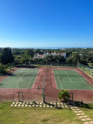 an overhead view of a tennis court at Sea-Stretch viewing SuperKing flat by BentoBox in Albufeira