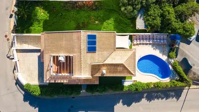 an aerial view of a house with a swimming pool at Villa Cinema - Perfect Union in Albufeira