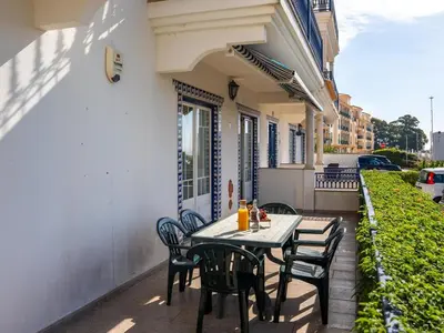 a patio with a table and chairs on a building at Oura Sunrise 3B Apartment by Stay ici Algarve Holiday Rental in Albufeira