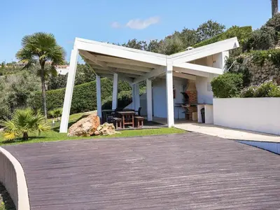 a pavilion with a table and a picnic table at Serenity 03 House by Stay ici Algarve Holiday Rental in Albufeira