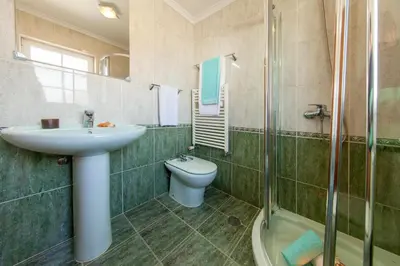 a bedroom with two beds and a window at Villa Ocean by Algarve Vacation in Albufeira