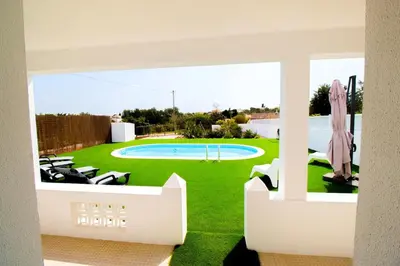 a view from the balcony of a house with a swimming pool at Villa Azul in Boliqueime